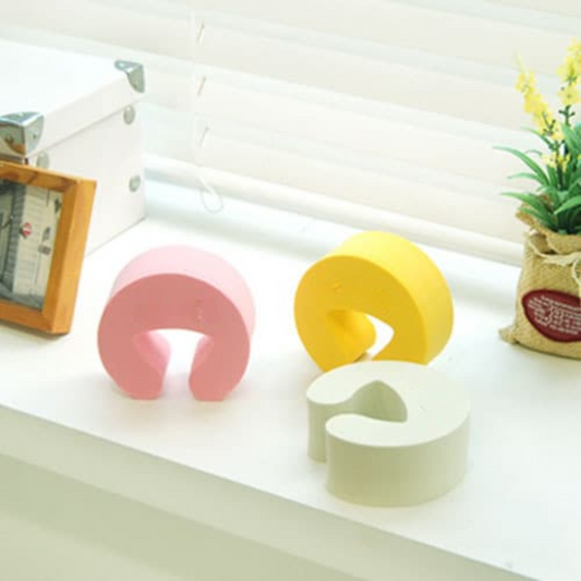 SoftClose baby door guard – soft EVA foam door stopper in arc shape to prevent door slamming and protect toddlers’ fingers  
